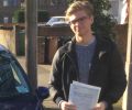 Adam with Driving test pass certificate