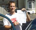 Lazlo with Driving test pass certificate
