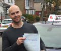 Tom1 with Driving test pass certificate