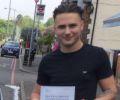 Dan with Driving test pass certificate