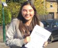 Dani with Driving test pass certificate