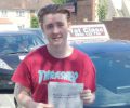 Josh with Driving test pass certificate