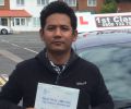 Kumar with Driving test pass certificate