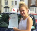 Lauren with Driving test pass certificate