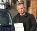 Lewis with Driving test pass certificate