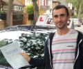 Lionel with Driving test pass certificate