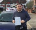 Luke with Driving test pass certificate