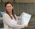 Michelle with Driving test pass certificate