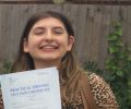 Paulina with Driving test pass certificate